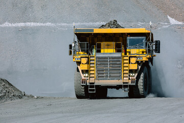 Wall Mural - Career dump truck is going to the gold mining range.