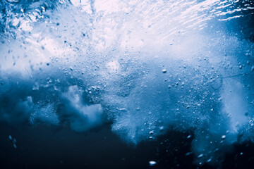 Wall Mural - Underwater wave crashing in ocean. Transparent water underwater