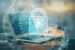 © peshkova - Double exposure of lock icon with man working on computer on background. Concept of network security.