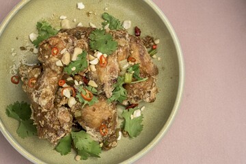 Sticker - Top view of delicious fried chicken with greens and seasonings