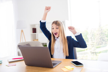 Canvas Print - Photo of little blond pupil student girl notebook table chatting online lesson call raise fists glad summer holidays beginning distance quarantine study home room house classroom indoors