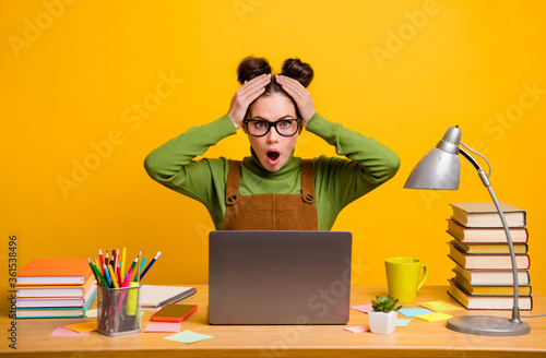 Portrait of her she attractive stunned girl geek programmer working remotely finance market stock share news fail failure reaction isolated bright vivid shine vibrant yellow color background