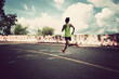 © lzf - Healthy lifestyle young fitness woman runner running on road