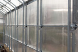 Fototapeta  - doors and windows of the greenhouse, handles for opening doors