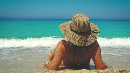 Wall Mural - Woman enjoying the beach at Greek island r