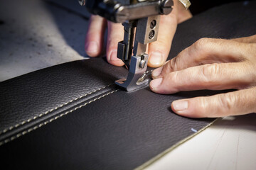 Tailoring of leather products. Repair of the car seat cover.