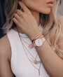Beautiful stylish white watch on woman hand