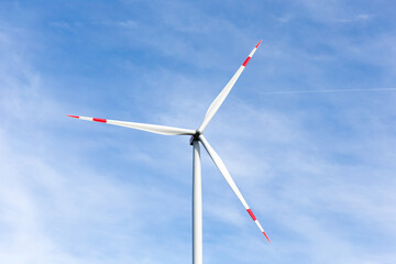 Wall Mural - A windmill with a blue sky in the background