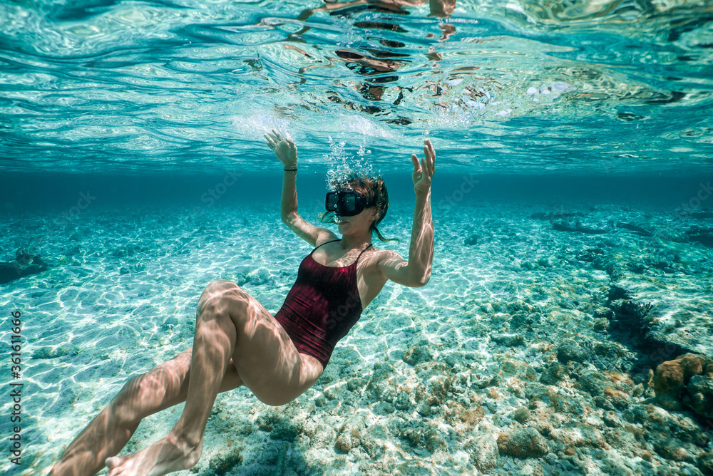Woman Floating Underwater  - obrazy, fototapety, plakaty 