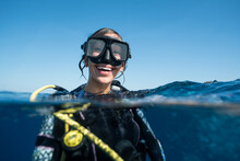 Woman SCUBA Diving Smiling In Ocean