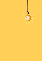 one burning light bulb on a yellow background