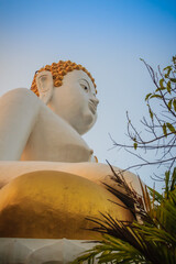 Beautiful big buddha image at Wat Phra That Doi Kham. Chiang Mai, Thailand. Wat Phra That Doi Kham (Wat Doi Kham or the Golden temple) is located at the top of a hill to the south west of the city.