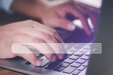 Leinwandbilder - Searching Browsing Internet Data Information with blank search bar.Search Engine Optimization SEO Networking Concept.hand of businessman working with computer laptop on desk in office.