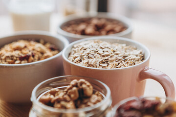 a delicious and crunchy oatmeal granola with honey, nuts, dried fruits and grains. Dynamic healthy food photography