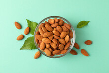 Bowl With Almond On Mint Background. Vitamin Food