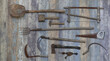 © serikbaib - agricultural tools on old wooden background