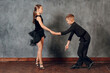 © primipil - Young boy and girl dancing ballroom dance Jive
