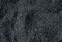 Black Sand Beach Macro Photography. Silky Black Beach Texture. Minimalistic Black Background. Tenerife Voulcanic Sandy Shore.