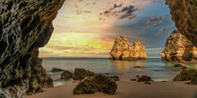 Scenic Silence Sunrise On Beautiful Beach With Rocks Near Lagos, Algarve, Portugal