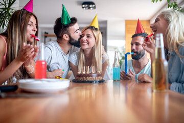 Wall Mural - Friends celebrating birthday at home.