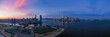 Panorama view of the Skyline of Lower Manhattan , Jersey City and Ellis Island in sunset day, New York City, United States. Shot from Hudson River 