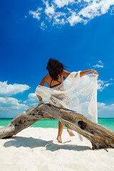 Sticker - Young woman on the white sand beach