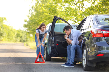 Wall Mural - Stressed drivers near broken cars after accident