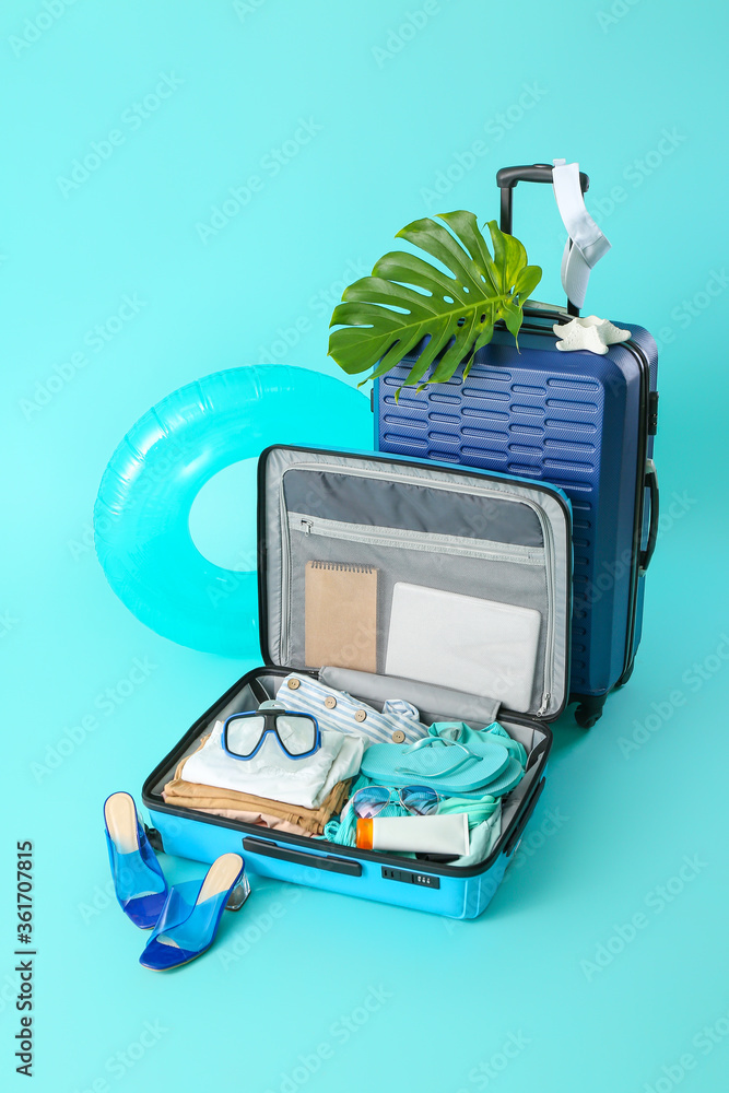 Packed luggage on color background. Travel concept