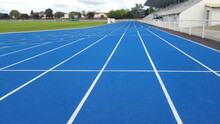 Athletics Running Blue Track White Line In A Sports Stadium
