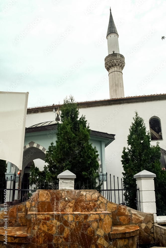 Minaret and fountain of the Murat Pasha Mosque in the old bazaar of ...