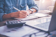 © photobyphotoboy - close up of a business man sitting at an office desk . Concept business analysis and planning