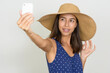 © Ranta Images - Happy beautiful multi ethnic tourist woman taking selfie