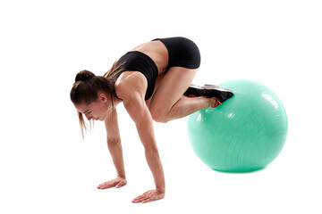 Fitness girl working with gym ball