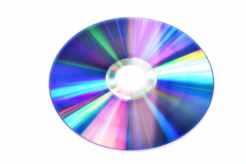 CD or DVD with colorful light reflection on surface in white background