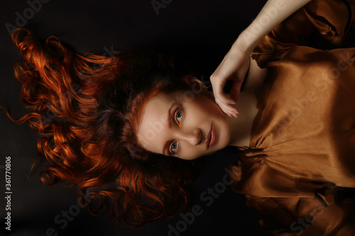 Conceptual art portrait of middle-aged red-haired woman