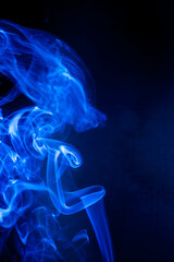 Blue smoke motion on black background.