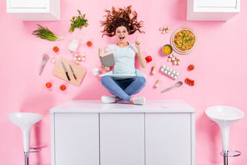 Wall Mural - Top above high angle view full body photo surprised girl sit table read cookbook think decide idea prepare yummy pizza evening meal flat lay eggs knife tomato isolated pastel color background