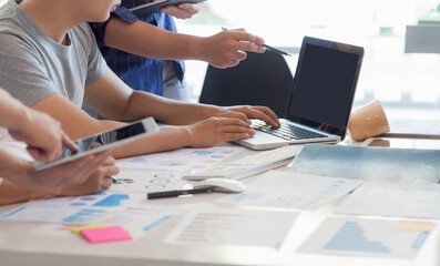 the new generation of business people work with laptops and discuss work. student groups work togeth