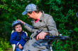 © manowar1973 - Bicycle ride of father and his son on baby seat.