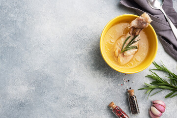 Wall Mural - Chicken broth and boiled chicken drumstick on a plate. Copy space