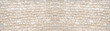 © Corri Seizinger - Natural beige white stone brick wall texture background banner panoramic panorama