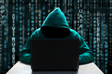 a computer hacker in the hood, with a hidden face, sits in front of a laptop, against a background o