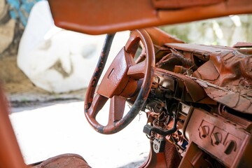 Wall Mural - Selective focus shot of a steering wheel of a rusty car