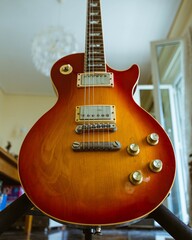 Wall Mural - Closeup shot of an electric guitar with a blurred background