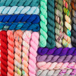 Square blocks of colorful yarn
