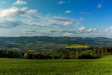 Wall Mural - Landscape with lots of clouds in the mountainous area of the Beskydy Mountains during a sunny afternoon.