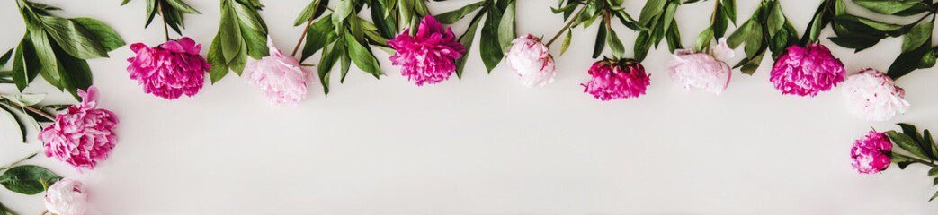 Wall Mural - Summer flowers layout. Flat-lay of pink and purple peony flowers arrangement over plain white background, top view, copy space. Florist shop website banner or wallpaper