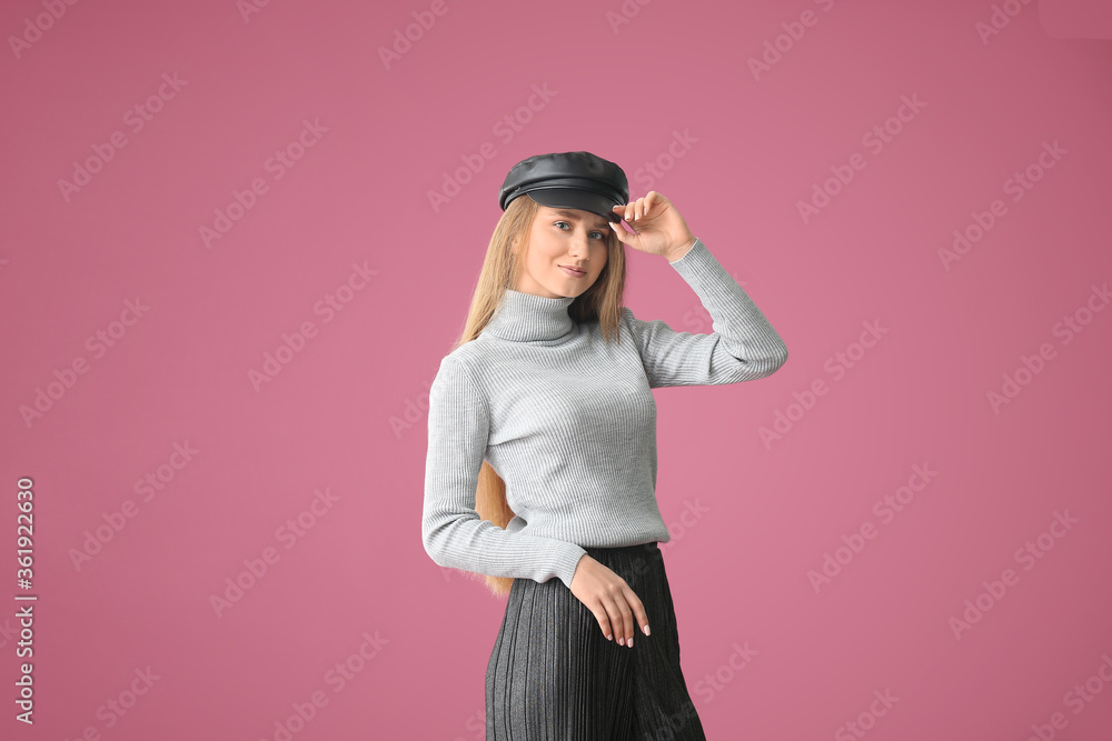 Beautiful young woman on color background