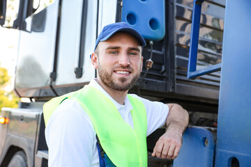 Male driver near big truck outdoors