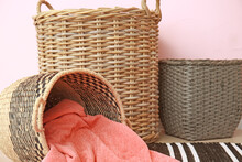 Wicker Baskets With Plaid In Room